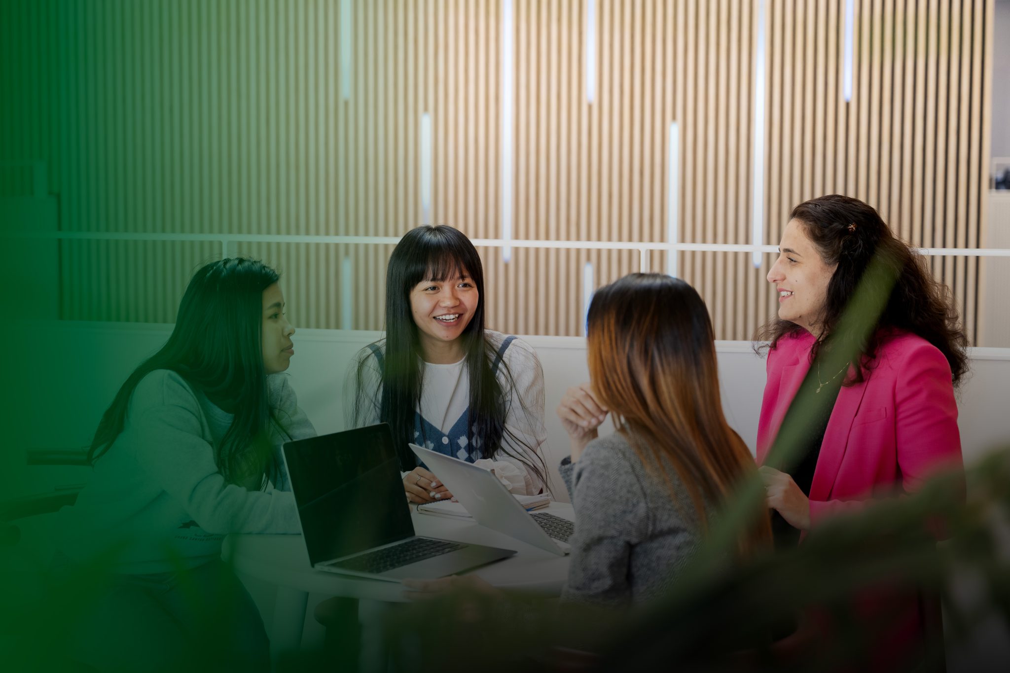 Photo of students doing group work at a table
